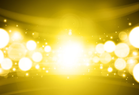 Golden glitter sparkles rays lights bokeh Festive Elegant abstract background.の写真素材