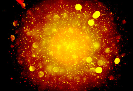 Dark Gold sparkle rays lights bokeh elegant abstract background. Dust sparks in explosion on black background. の写真素材