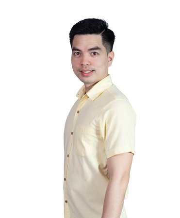 Portrait handsome young asian man wearing a yellow shirt smile sign isolated on white background. Asian man people. business success concept.の写真素材