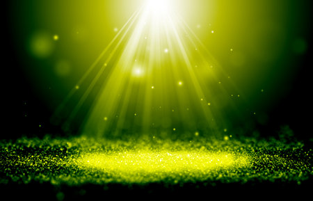 Green and Gold sparkle rays glitter lights with spotlight bokeh elegant show on stage abstract background. Dust sparks background.Spotlight backgroundの写真素材