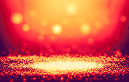 Gold and Orange color sparkle rays glitter lights with spotlight bokeh elegant show on stage abstract background. Vintage background.Spotlight backgroundの写真素材