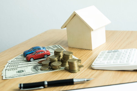 Accountants are checking the homeowner's finances to ensure there is a deposit.の写真素材