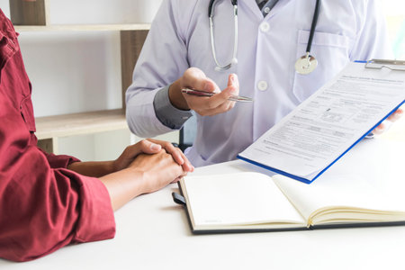The dentist examining the teeth of the patient found that his teeth have improved.の写真素材