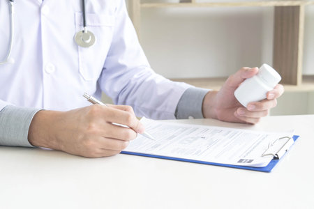 The doctor was examining the patient's teeth and found that the patient's teeth were normal.の写真素材