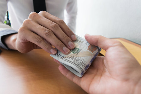 Company employees have been corrupt by bringing money to the company's human resources department. To allow him to be promoted to managerの写真素材