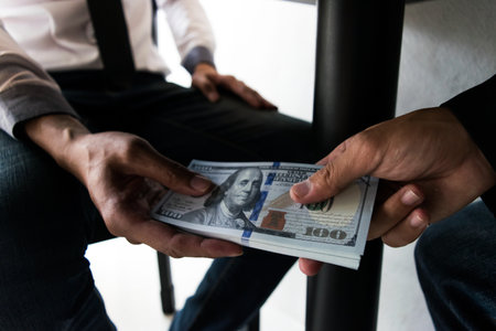 Company employees have been corrupt by bringing money to the company's human resources department. To allow him to be promoted to managerの写真素材