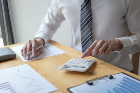 The young accountant is checking the money of a reputable national financial organization in a country.の写真素材
