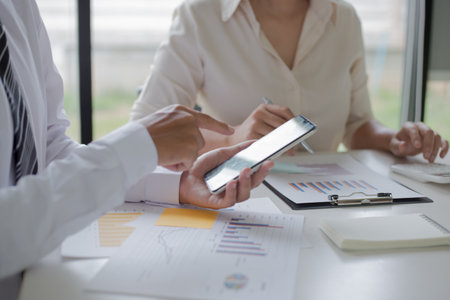 Both accountants have checked the company's finances. Have checked the work and profit of the company In order to plan for business expansion to the European zone and nearby areasの写真素材