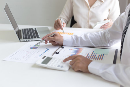 Both accountants have checked the company's finances. Have checked the work and profit of the company In order to plan for business expansion to the European zone and nearby areasの写真素材