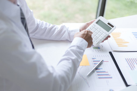 Both accountants have checked the company's finances. Have checked the work and profit of the company In order to plan for business expansion to the European zone and nearby areasの写真素材