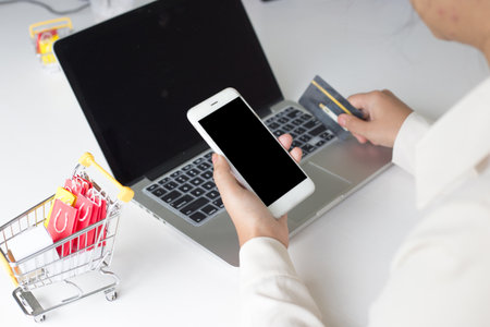 Buy products online, business people are bringing credit cards to pay for purchases. Online credit cards are easy to use.の写真素材