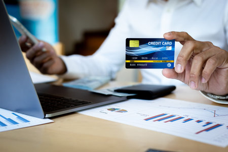 Online shopping concept, young men use credit cards to pay for products online via the internet