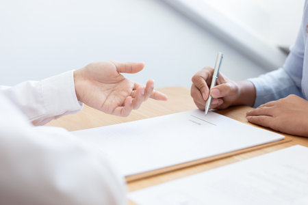 Business people negotiate for customers to sign land sales contracts, Property purchase contract of conceptの写真素材