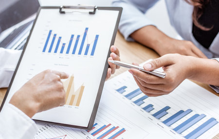 Meeting a team of businessmen, Executives and accountants meeting about the company's revenue graph...