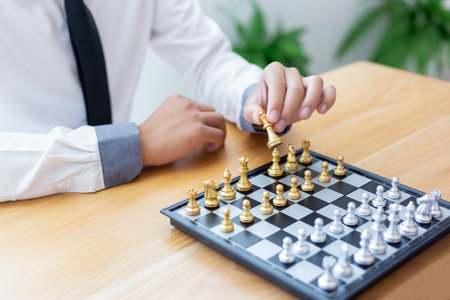 Business men make plans to play chess with Prudence and success, Management or leadership concept.の写真素材