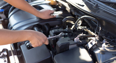 Car mechanic has checked the condition of the engine in wrench, Car repair service concept.の写真素材