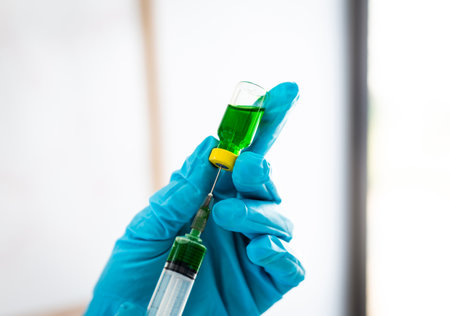 Doctors or scientists prepare a vaccine to prevent a new strain of influenza to inject the patient to create immunity in the body, Vaccinate concept.の写真素材