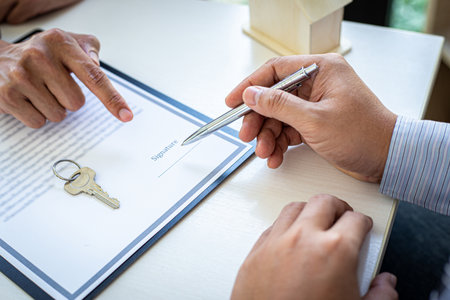 Home insurance agents offer terms and conditions to clients and get approval, home purchase and insurance contracts, Real estate investment of Conceptの写真素材