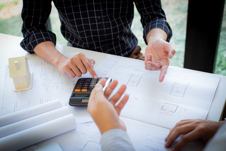 Engineers or architects are meeting a team to design the architectural structure in the design with...