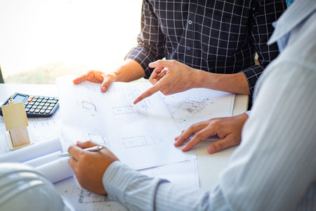 Engineers or architects are meeting a team to design the architectural structure in the design with...