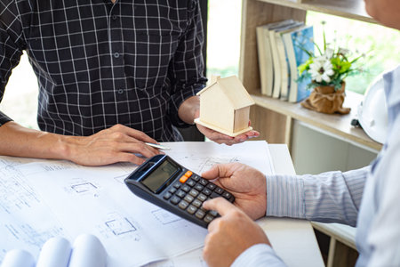 Engineers or architects are meeting a team to design the architectural structure in the design with...