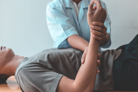 Professional therapists are stretching muscles, patients with abnormal muscular symptoms, physical...