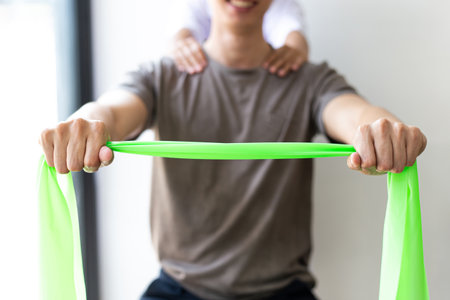 Professional therapists are stretching muscles, patients with abnormal muscular symptoms, physical rehabilitation therapies and treatment of physiological disorders by physiotherapists concept.の写真素材