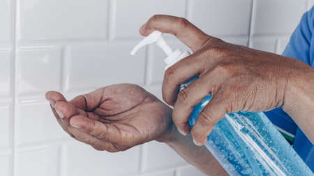 Alcohol gel is used for inhibition of bacteria and the virus Covid-19, Virus removal and protection of infections,Man pressed alcohol gel to wash hands, Virus covid-19 concept.の写真素材