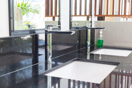 Public sinks, Handwashers for people using public toilets, Public toilets and hygiene concept.