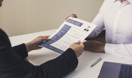 Employer or HR department is reading the resume and interviewing the ability of new employees, Employer is selecting job applicants, Employment and Recruitment Concept.の写真素材