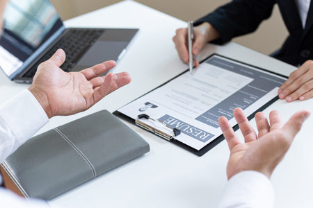 Managers or HR departments read resume and interview applicants for selection as a company real...