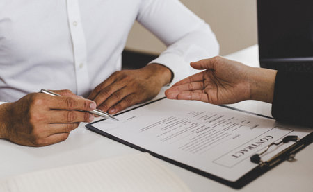 Approving and signing contracts concept, New employees are approved to work in the stock market and have signed contracts with major executives.の写真素材