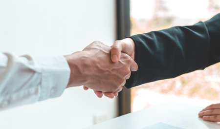 Financial accountants and marketers shaking hand to congratulate the double-digit real estate...