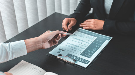 HR head is reading the resume and information about the candidate's history, Field employers are interviewing job applicants and negotiating agreements, Recruitment and job applications concept.の写真素材
