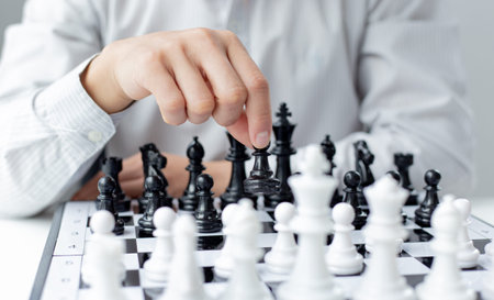 Business men make plans to play chess with Prudence and success, Management or leadership concept.