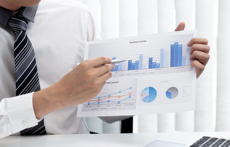 Marketing businessmen are analyzing financial and insights strategies for generating revenue...