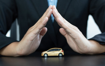 Car dealers or insurance managers cover and protect against damage and the risk of driving, Protecting and after-sales care concept.の写真素材