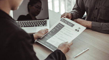 Managers or HR departments read resume and interview applicants for selection as a company real estate agent, Employment and selection of new staff representatives concept.の写真素材