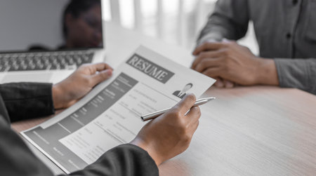 Managers or HR departments read resume and interview applicants for selection as a company real estate agent, Employment and selection of new staff representatives concept.の写真素材