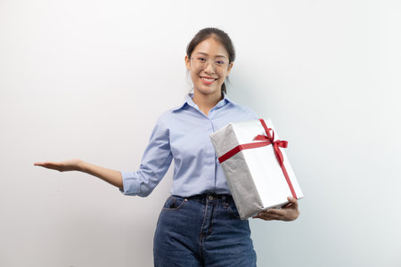 Asian women rejoice with the gifts they receive on important and special days, Christmas surprise, New year's surprise, Surprise important day, Birthday surprise, Gift box.の写真素材