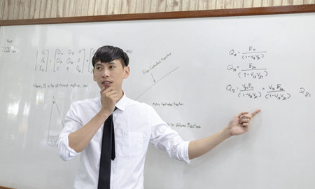 Asian clothing designers are measuring customers' body sizes in preparation for tailoring in design...