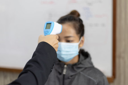 Teacher is teaching physics to students during the new school days after a long break, High school...