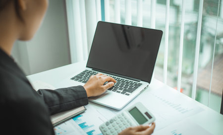 Financial businessmen analyze the graph of the company's performance to create profits and growth, Market research reports and income statistics, Financial and Accounting concept.の写真素材