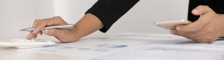 Accounting businessmen are calculating income-expenditure and analyzing real estate investment data,...