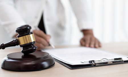 Judge or a lawyer works documents in the courtroom and analyze the various laws for justice and accuracy, Litigation and justice concept.の写真素材