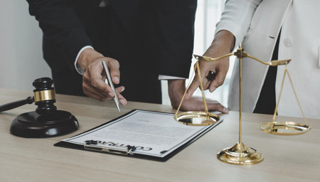 Attorneys or consultants work in the courtroom and negotiate with clients or complainants who want justice in corporate fraud cases, Litigation and justice concept.の写真素材