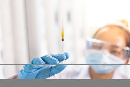 Doctors prepare antiretroviral drugs to stop the spread of serious diseases, Antibiotics prevent new strain of flu concept.の写真素材