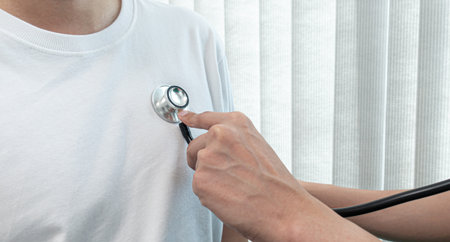 Doctor using sphygmomanometer with Stethoscope to check the heart rate of patients in the examination room at the hospital, Physical examination or health examination concept.の写真素材