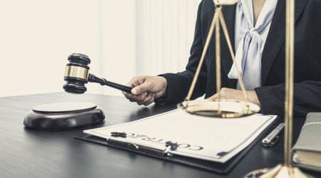 Young woman is saving money and calculating the income and expenses of the house due to the poor economic situation which makes saving money, Save money concept.の写真素材