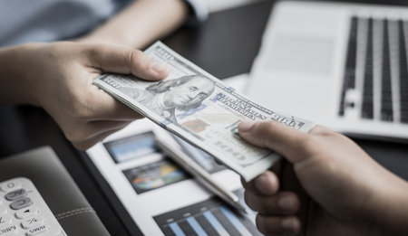 Counting money, businessmen have analyzed between cash and credit card which is consistent and convenient to spend in the present day.の写真素材